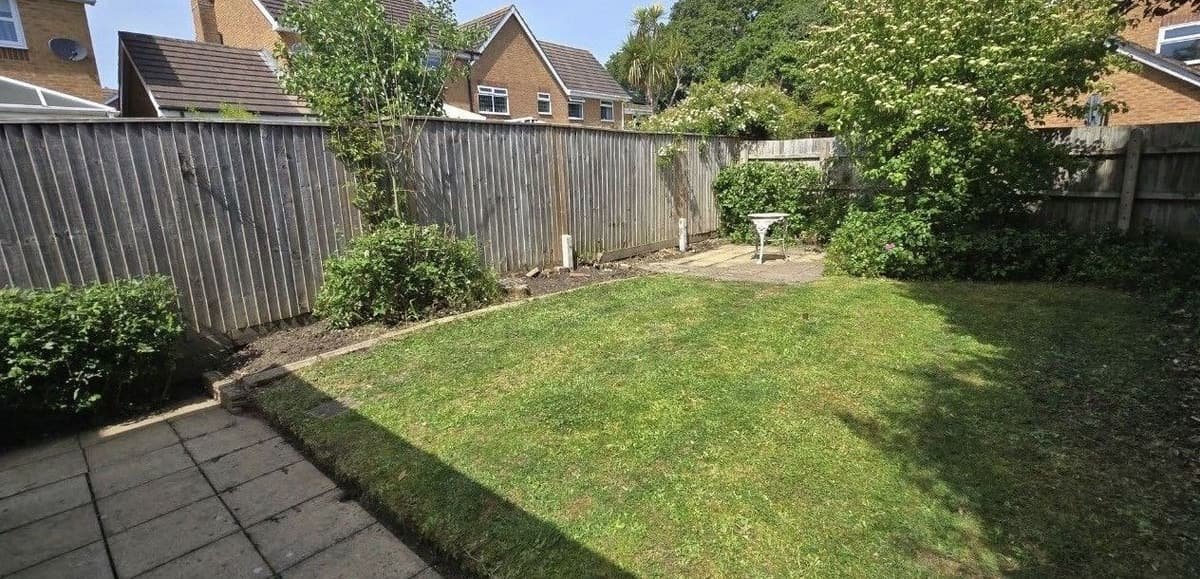 Rear lawn cut and borders tidied so the garden presents well